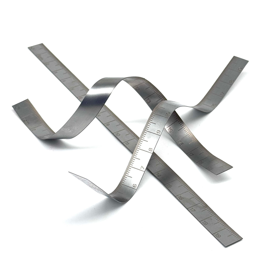 Metallic tape measure on a white background