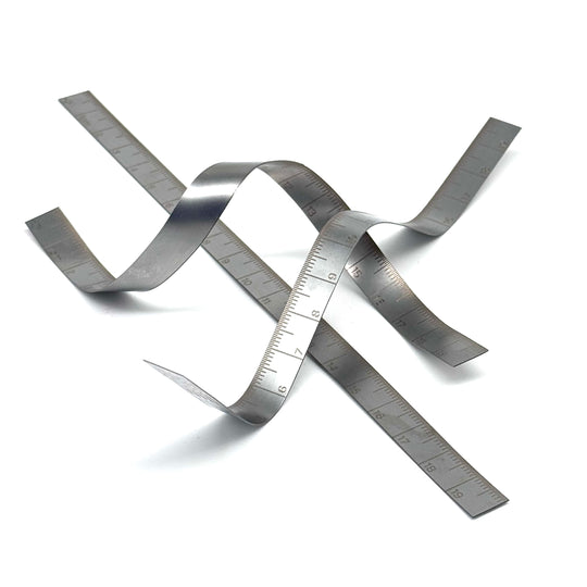 Metallic tape measure on a white background